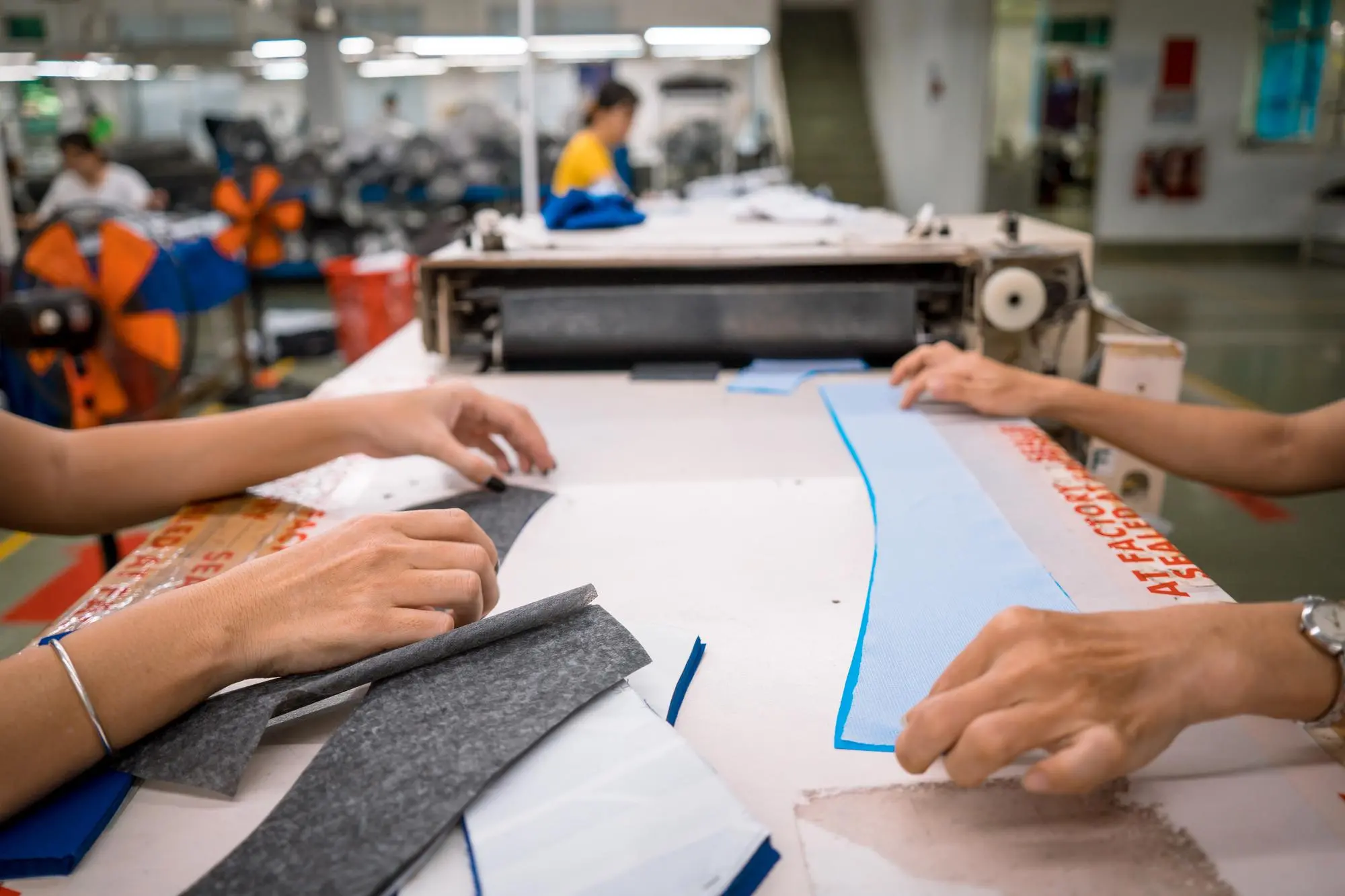Custom apparel manufacturing in progress in Sialkot